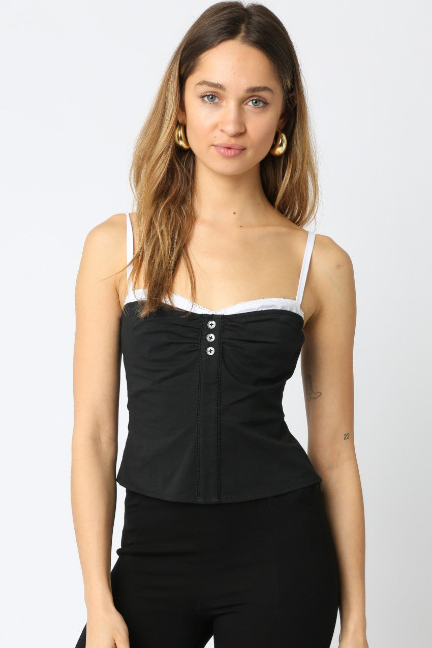 Featuring a double layered top wth a buckle closure and adjustable straps