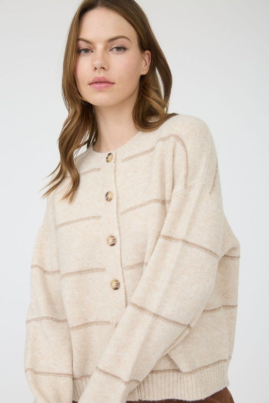 Featuring a relaxed fit, striped button down cardigan