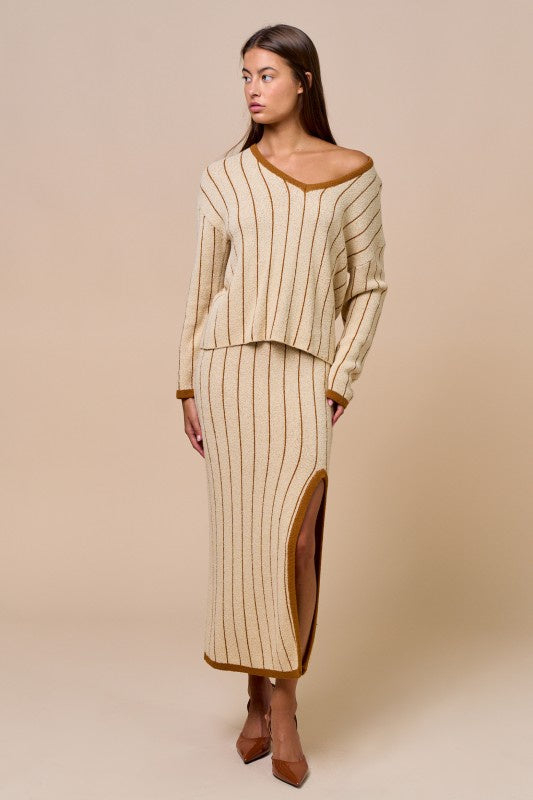 Pairs with the matching 'Alissea Midi Skirt'

Featuring a knit striped V neck sweater