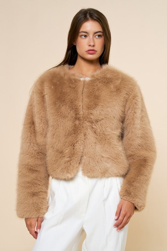 Featuring a fur jacket with silver beaded detail