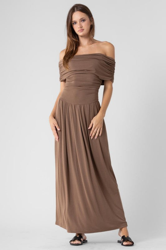 Featuring an off shoulder drop waist maxi dress

In the color brown 