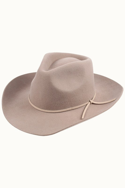 Featuring a stylish, chic and classy unisex wide brim cowboy hat with a minimal decorative band and UV protection in the color light brown