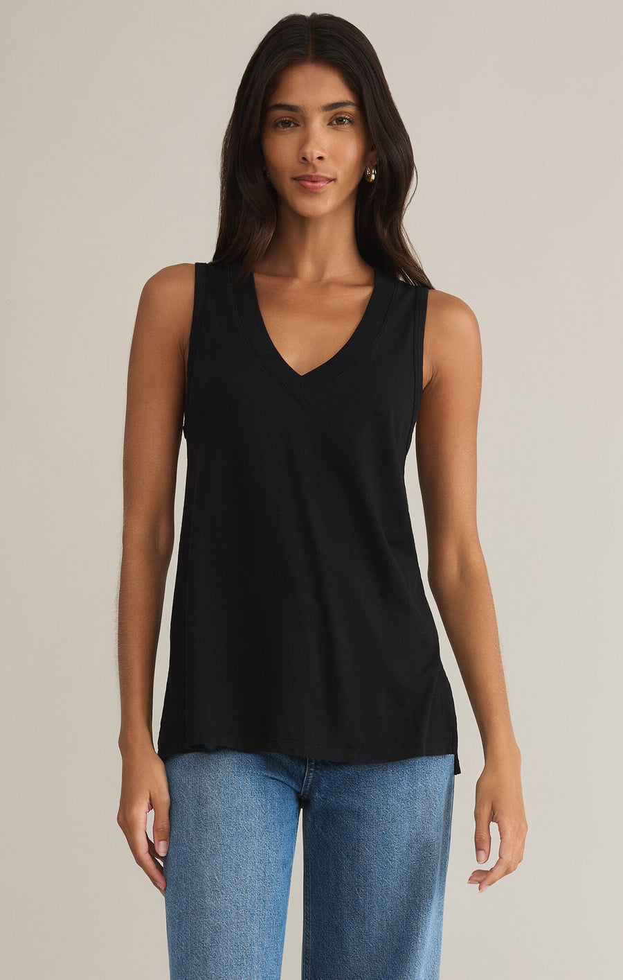 Featuring a V-neck sleeveless loose fit tank top in the color black 