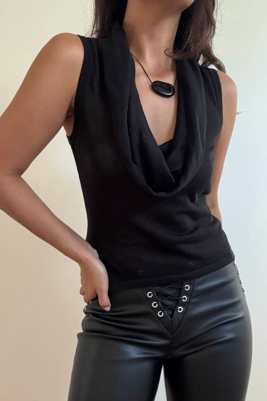 Featuring a black deep cowl neck sleeveless knit top