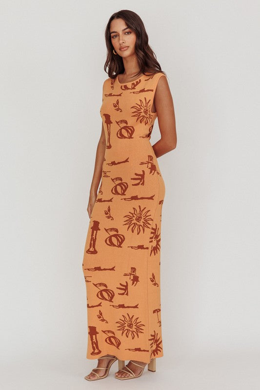 Featuring a back tie printed knit maxi dress in the color apricot 