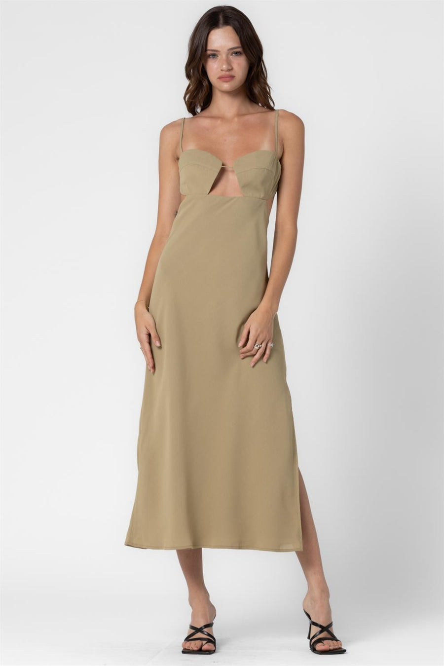 Featuring a cut out front midi dress with an open back and side slit details in the color sage 