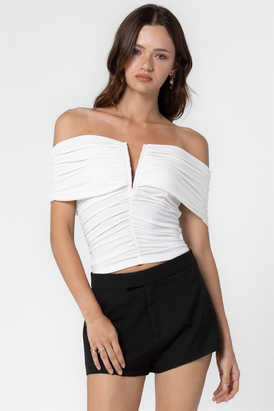 Featuring&nbsp; an off shoulder top with a V wire in the color white 