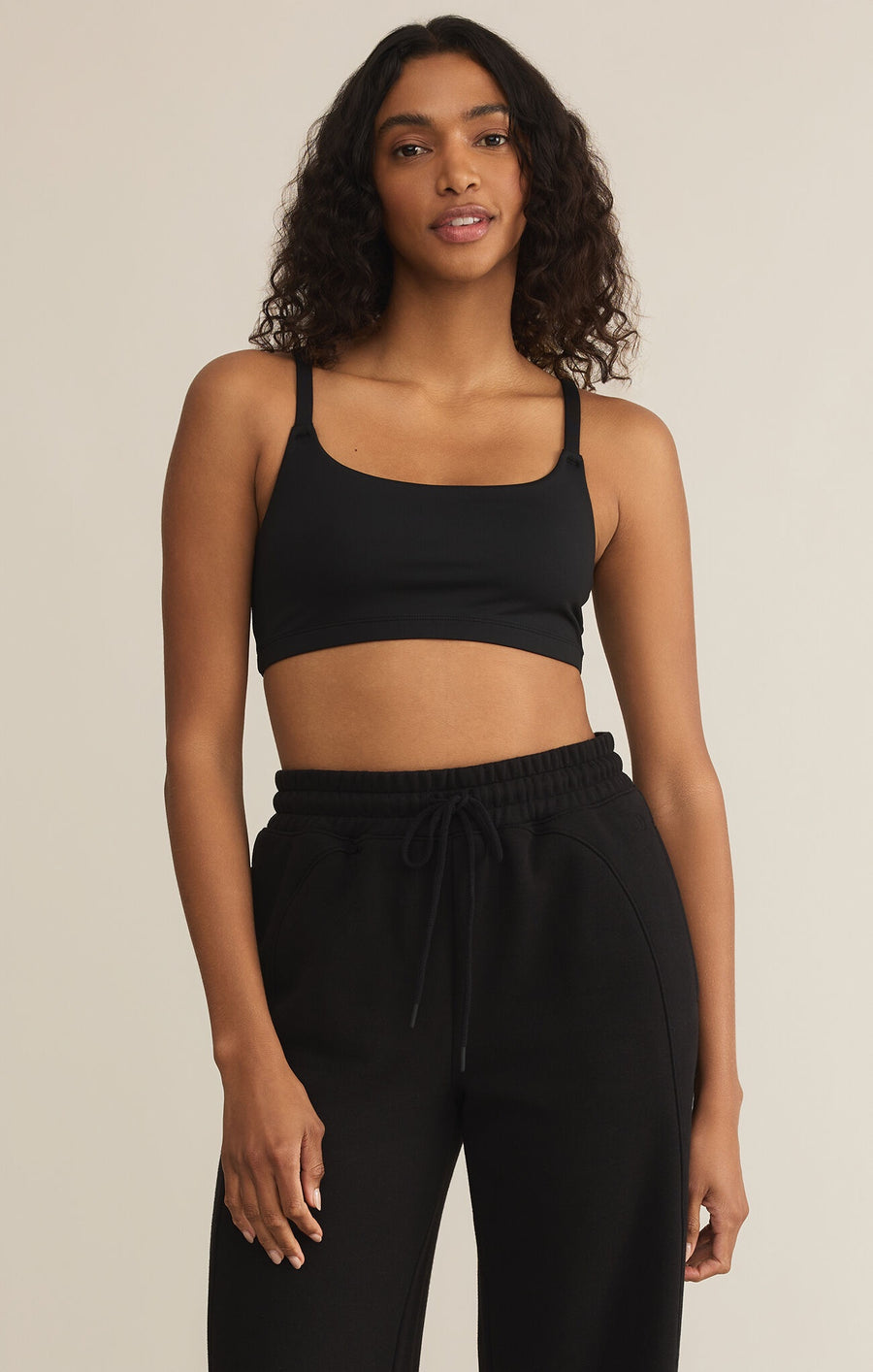 Featuring a butter smooth adjustable strap bralette in the color black 