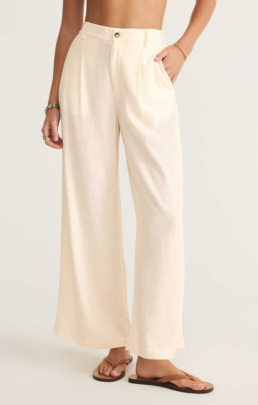 Featuring a high waisted loose fit pant in the color sea salt 