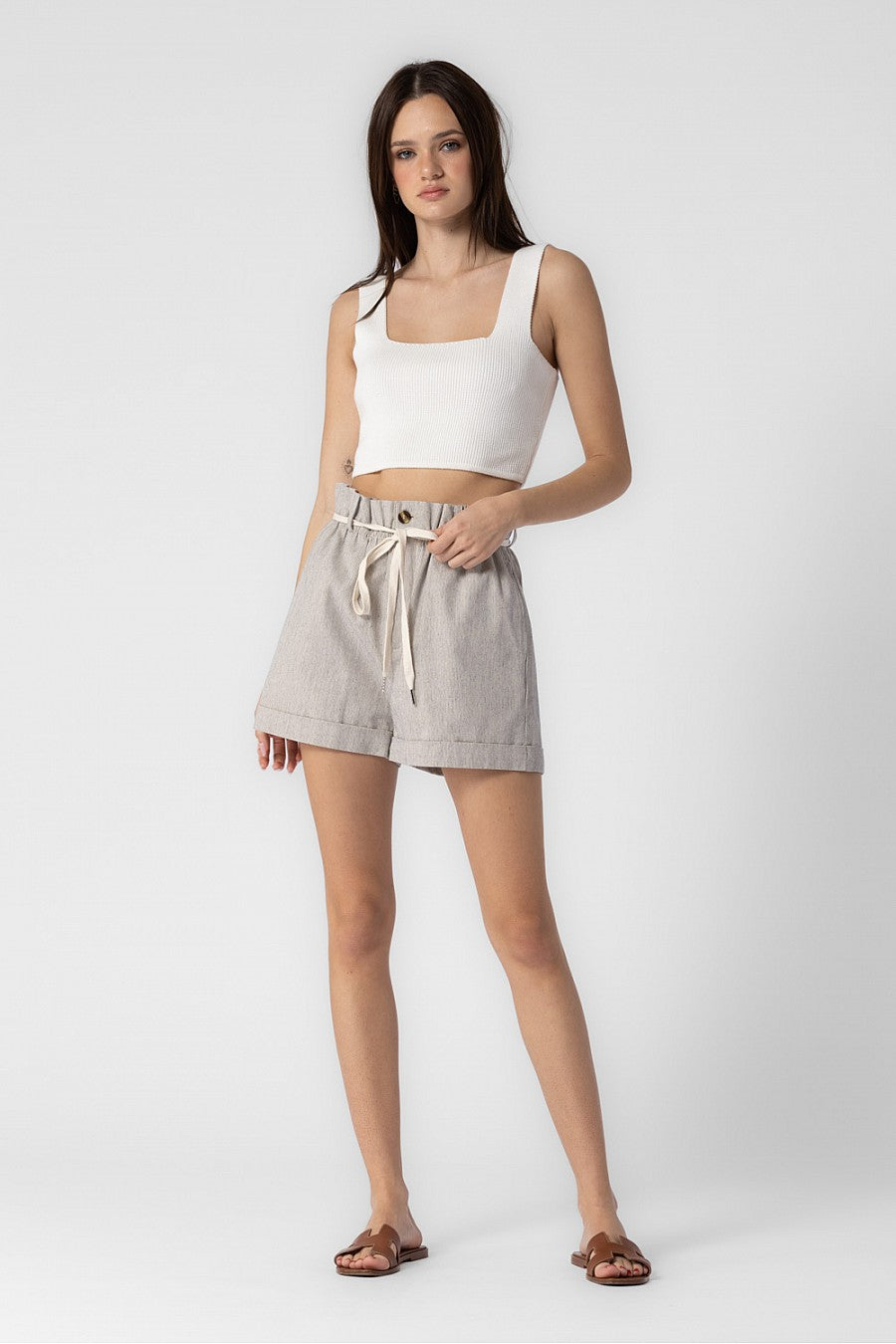 Striped, highwaisted cuffed shorts with a tie belt closure.