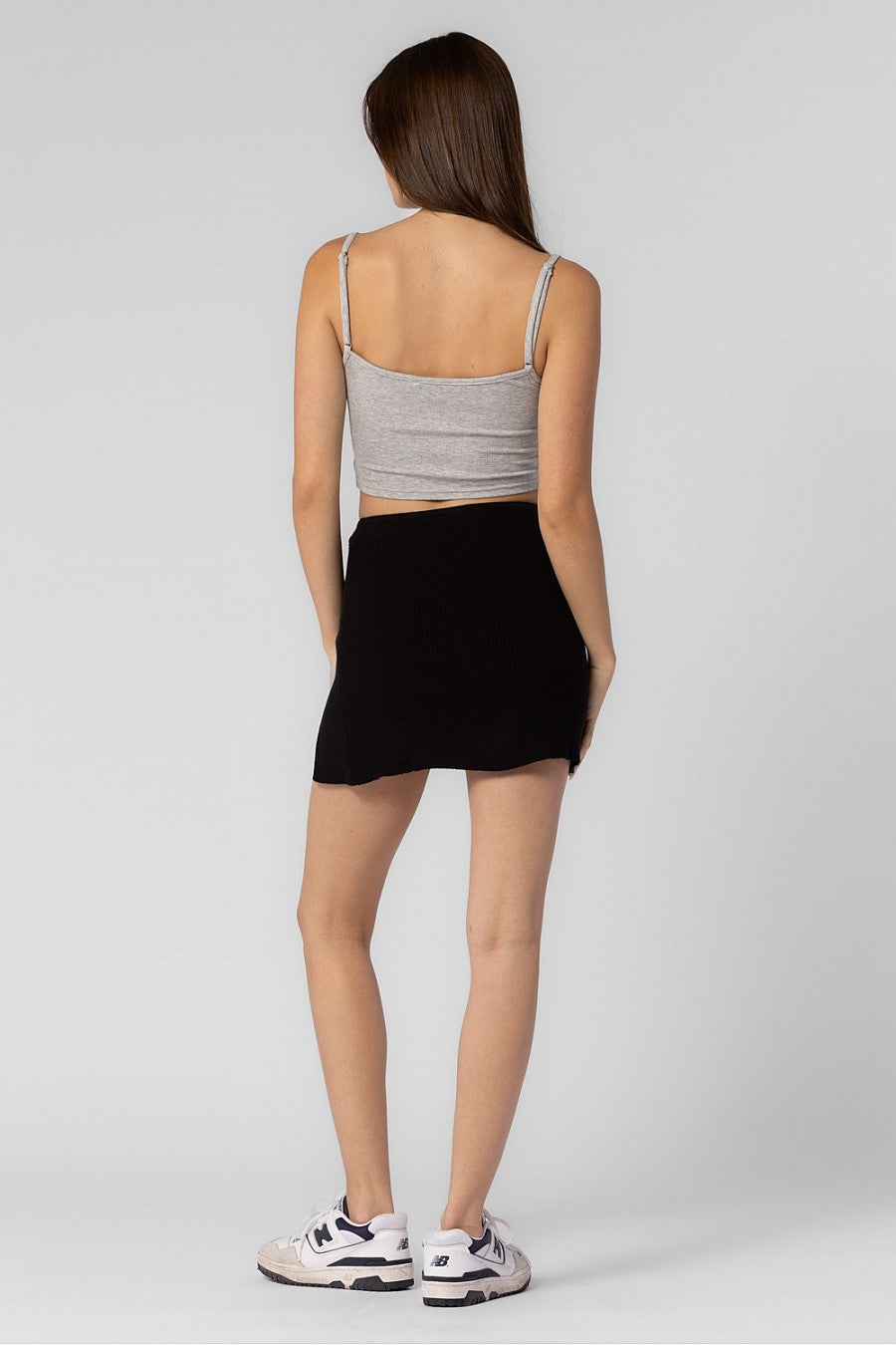 black mini skirt with side slit.