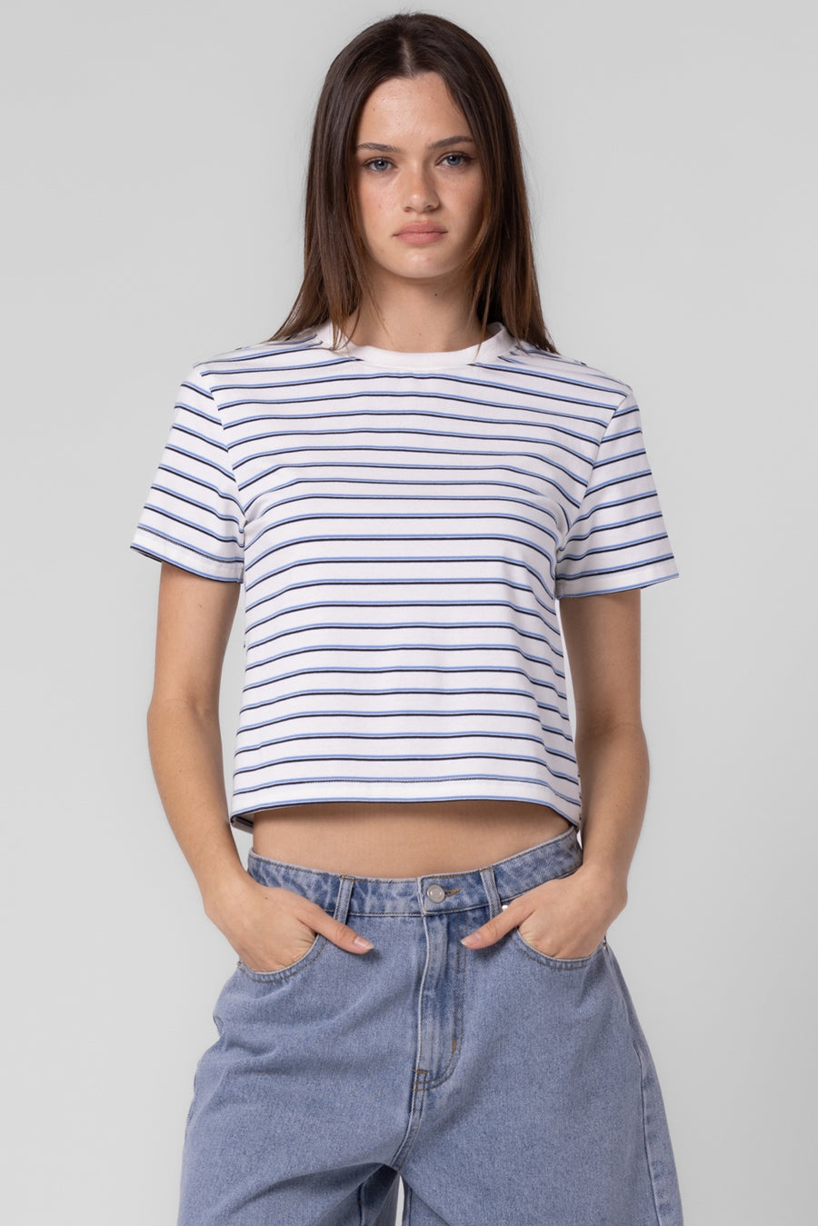 Featuring a short sleeve striped crop top in the color ivory blue stripe