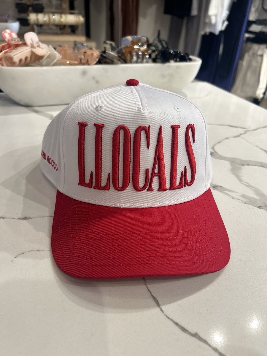 Featuring a snap back cap with the logo " LLocals Only' in th colors red and white 