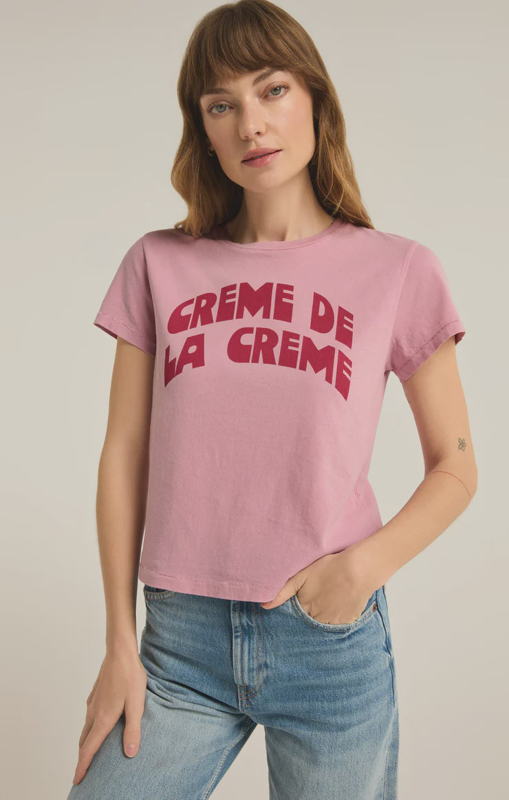 Featuring a printed top with the logo 'Creme De La Creme Tourist Tee' in the color pink 