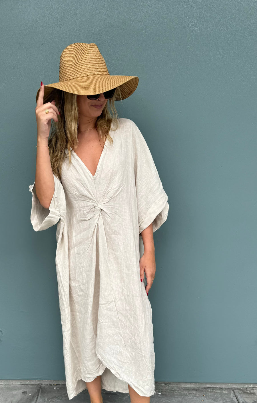 Featuring a linen twist front beach cover up in the color beige 