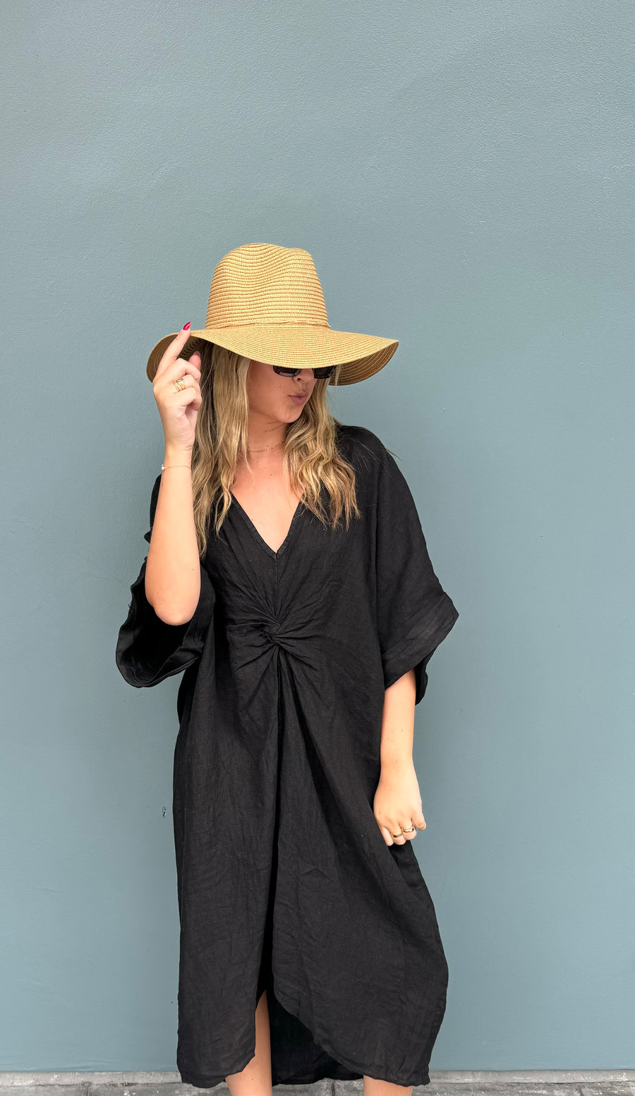 Featuring a linen twist front beach cover up in the color black