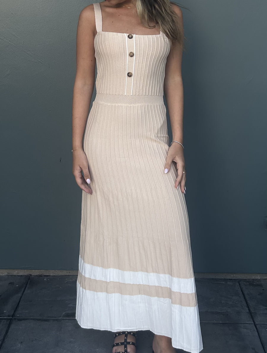 Featuring a knit maxi dress with a button up front and a cinched waist

In the color sand 