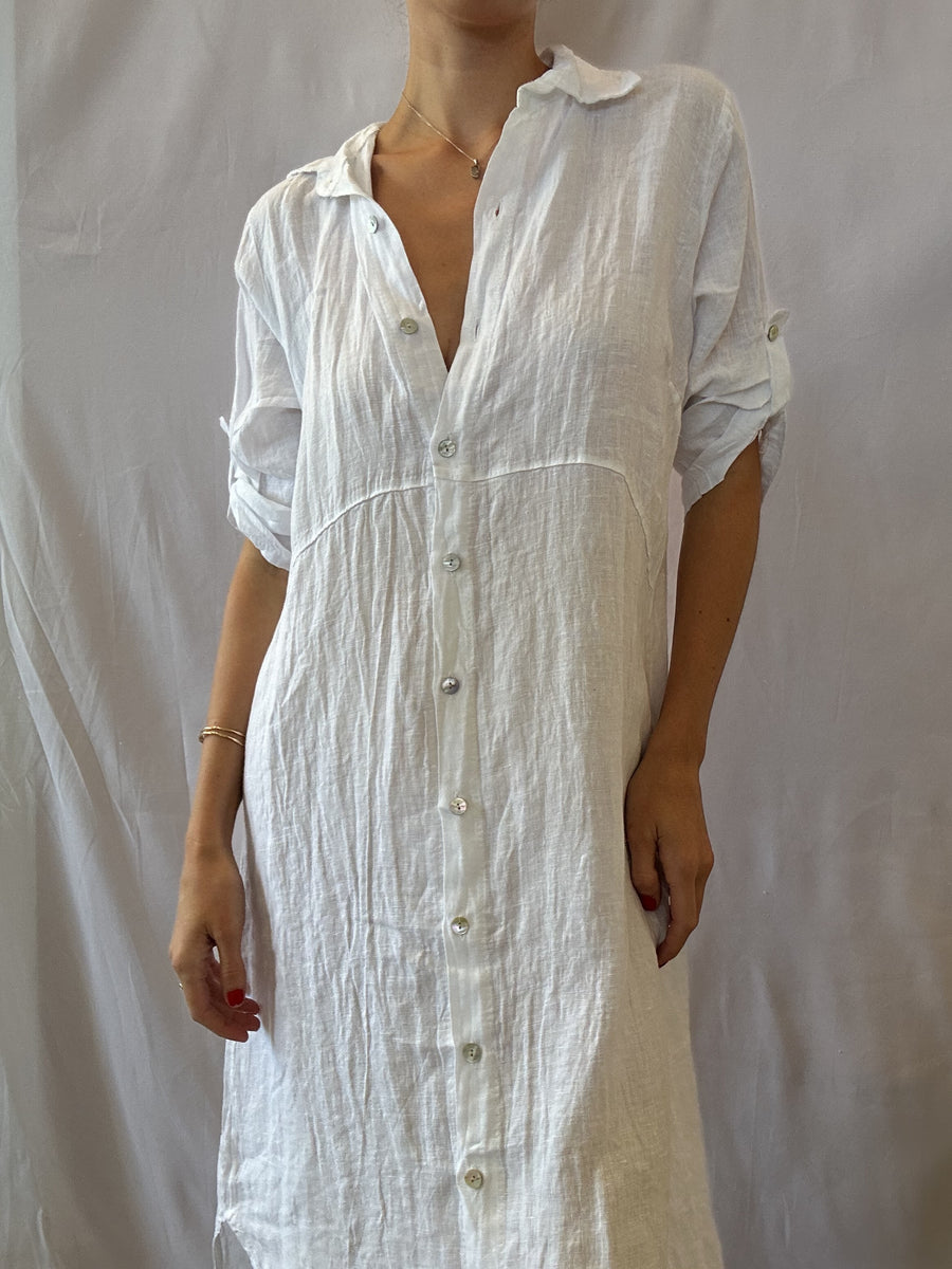 Featuring a button up linen midi dress in te color white 