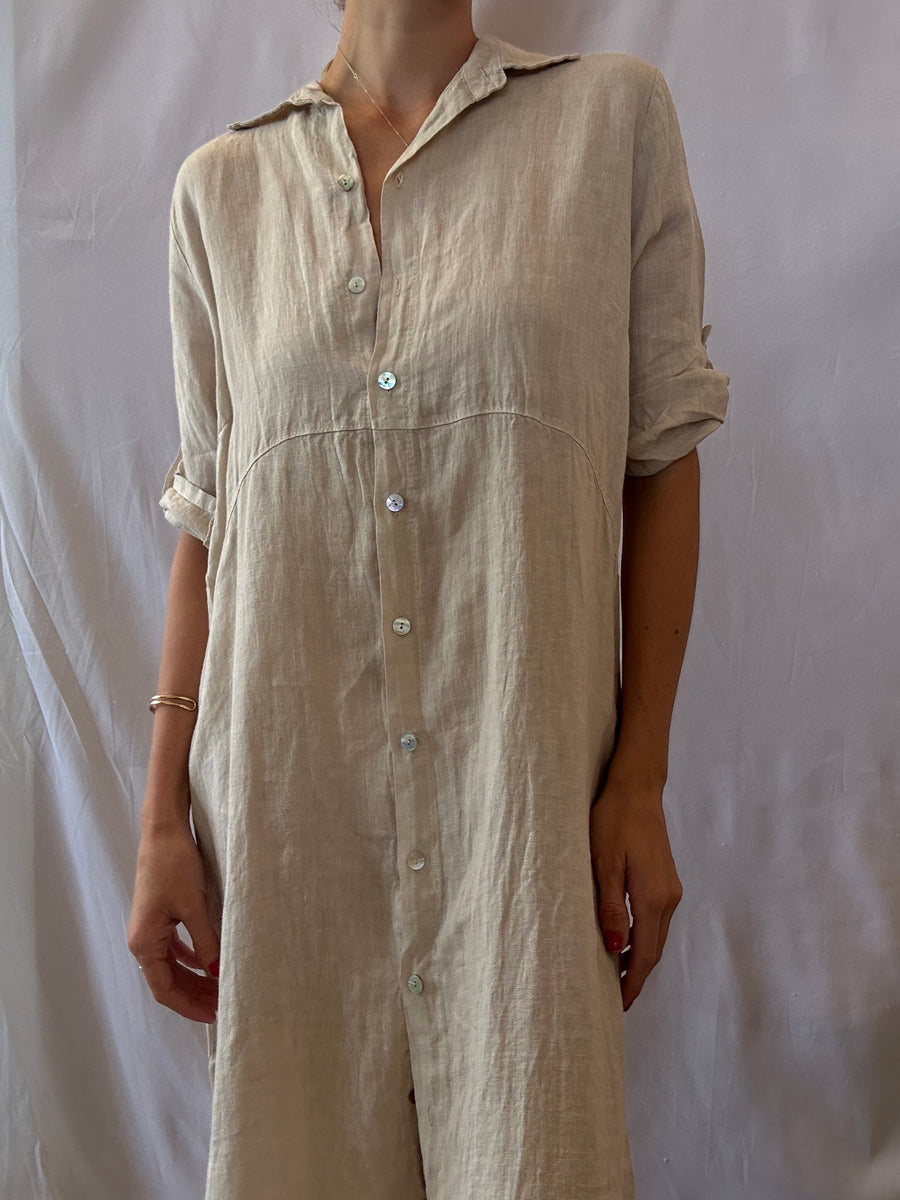 Featuring a button up linen midi dress in the color beige 