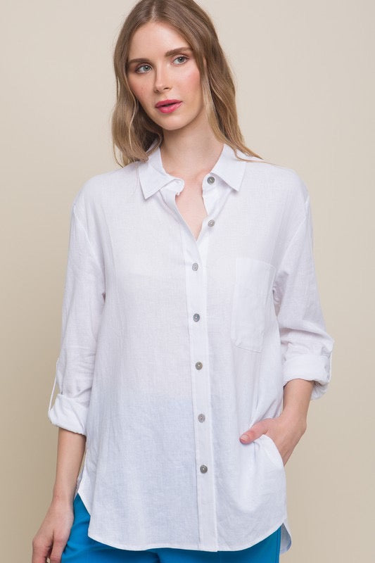 Long sleeve white buttoned down linen shirt.