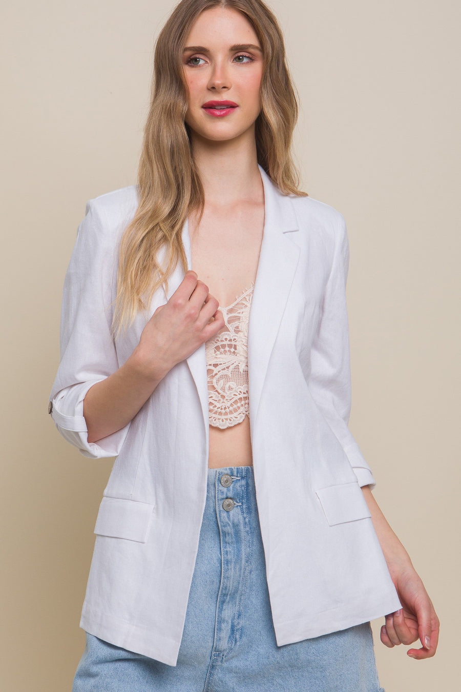 Linen blazer in the color white.