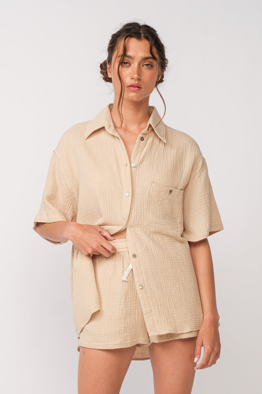 Candy tan colored short sleeve shirt with collar.