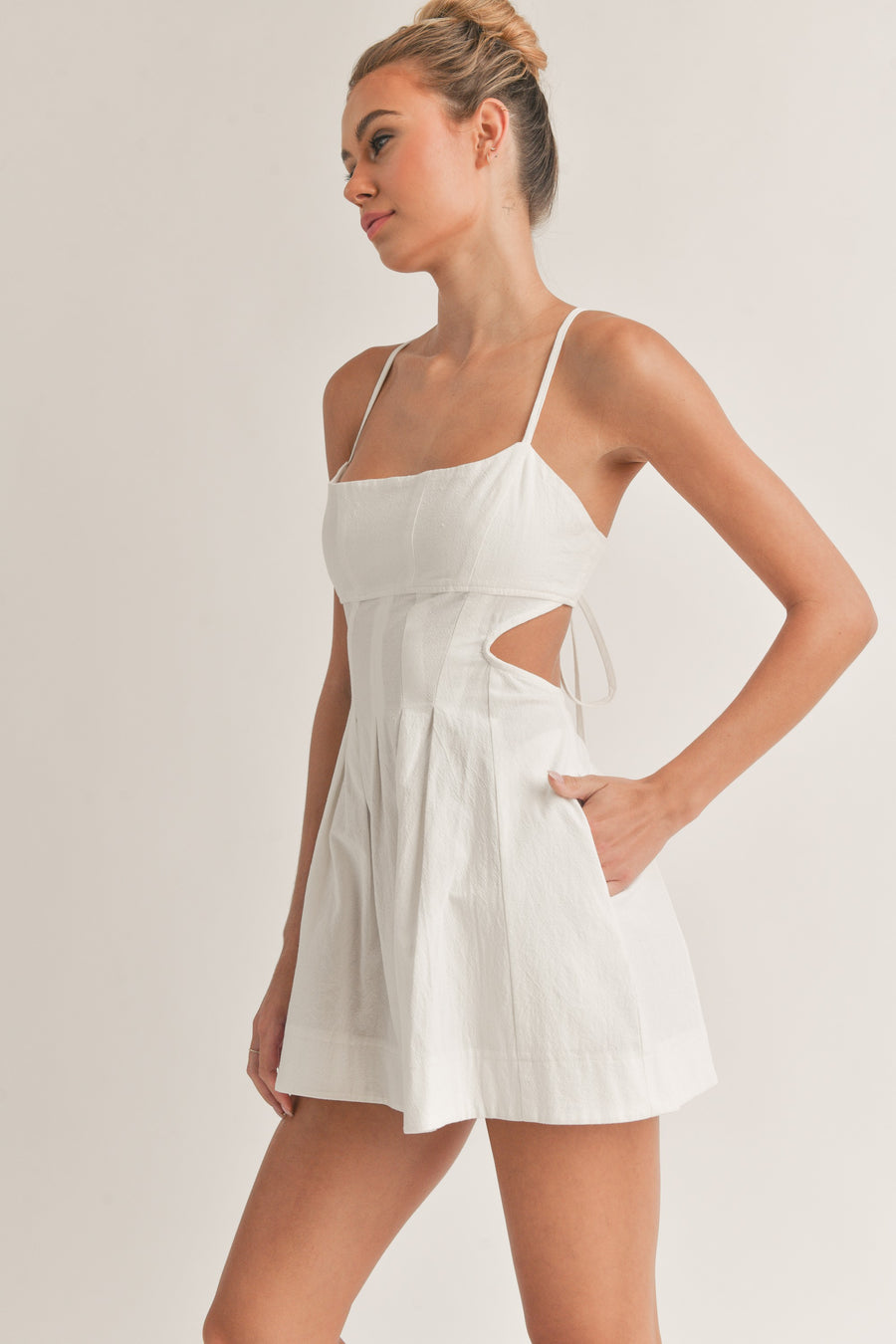 Off white mini dress with cut open back.