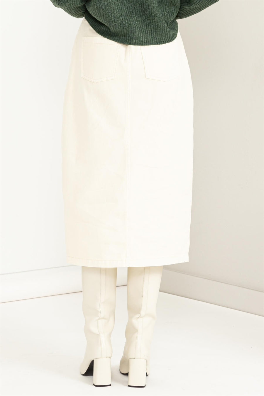 Cream midi skirt with slit.