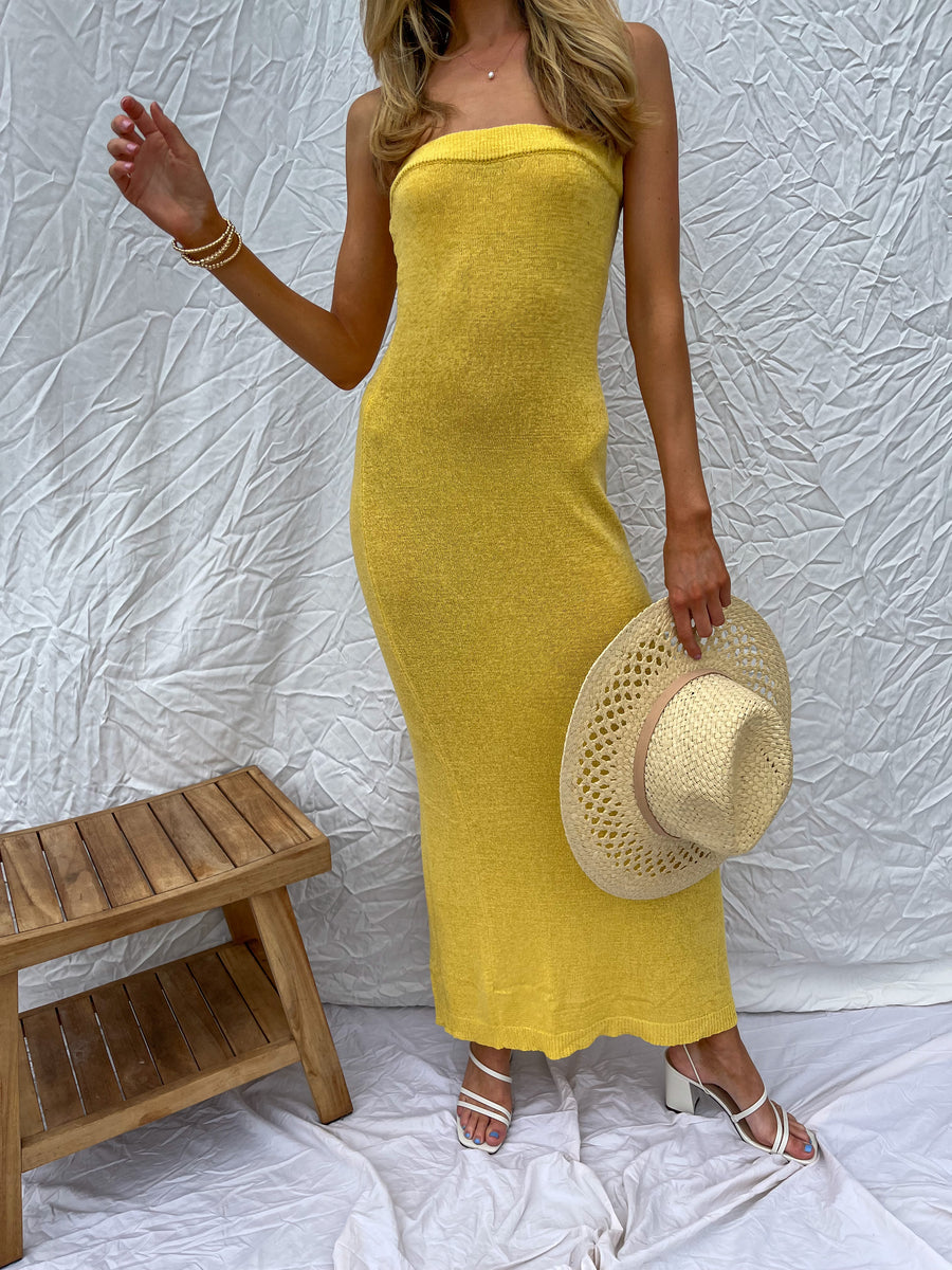 Honey colored maxi dress with slit in the back.