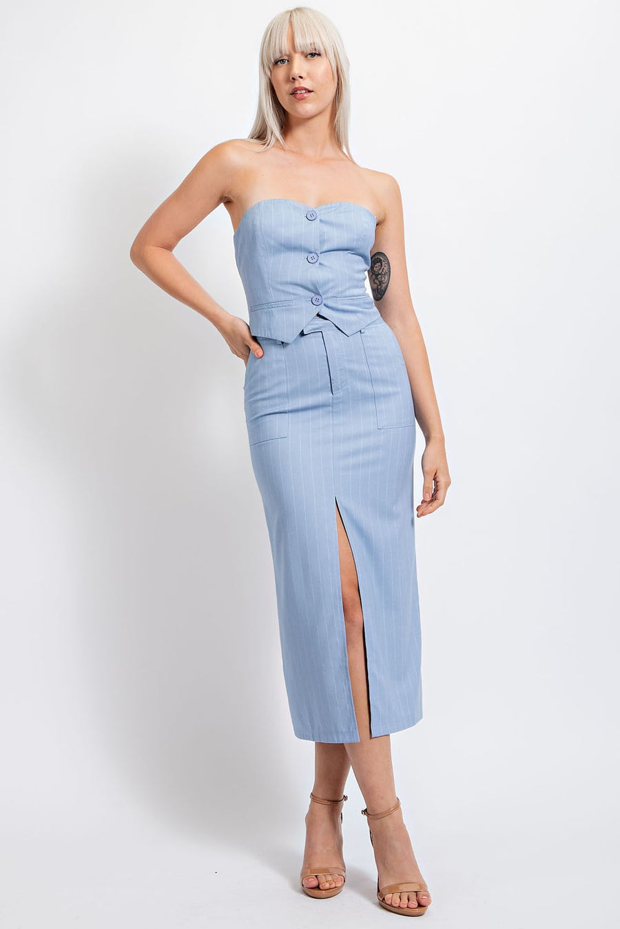 Light blue midi skirt with front slit.