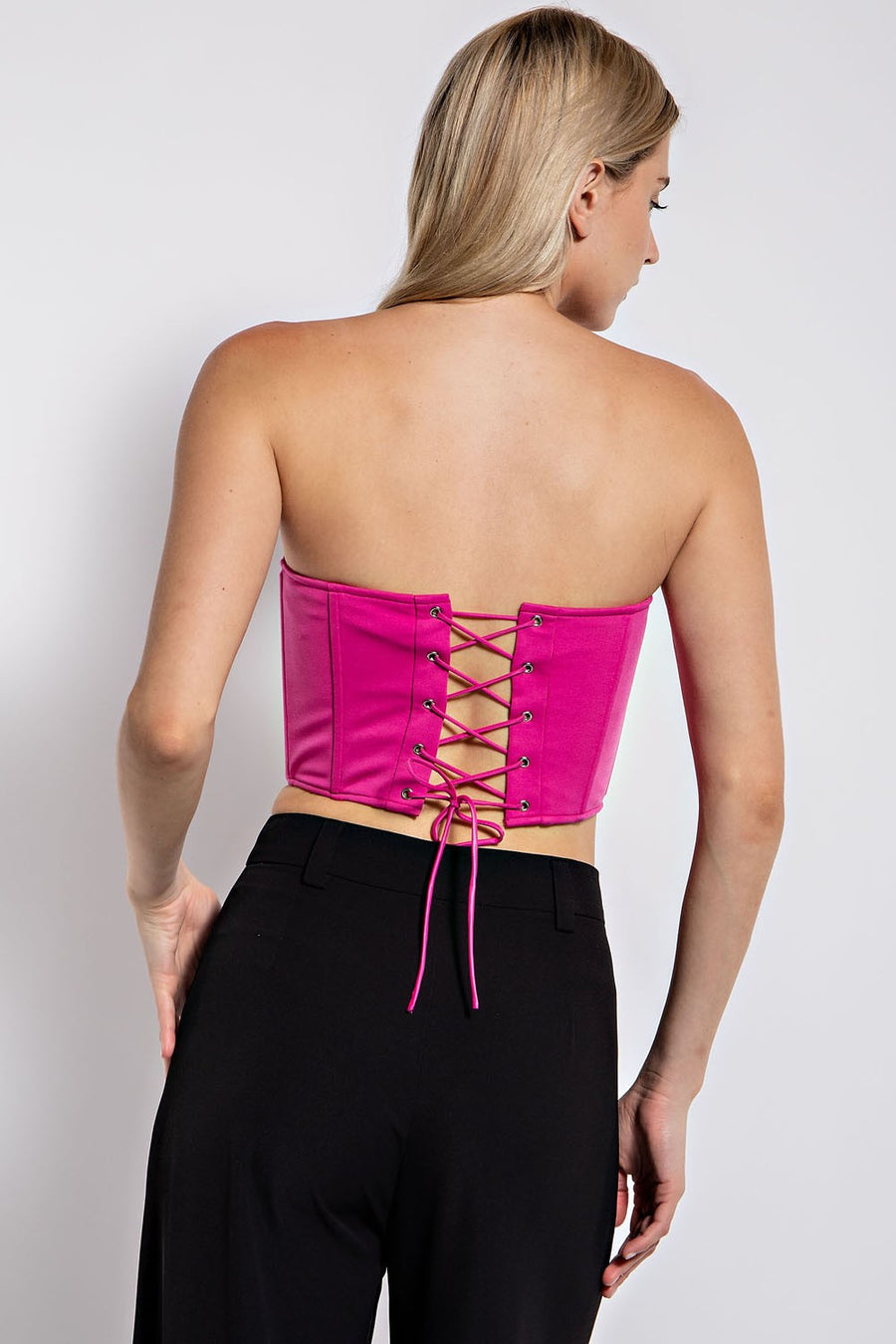 strapless corset top in the color hot pink.