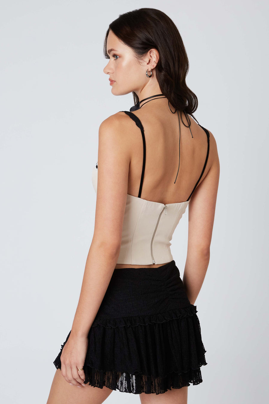 Slightly cropped top with ribbon detail along the neckline and lace straps.