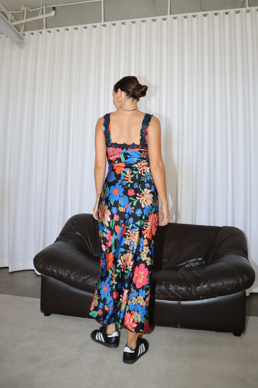 Maxi dress with lace trim along the shoulder straps and a plunge neckline.