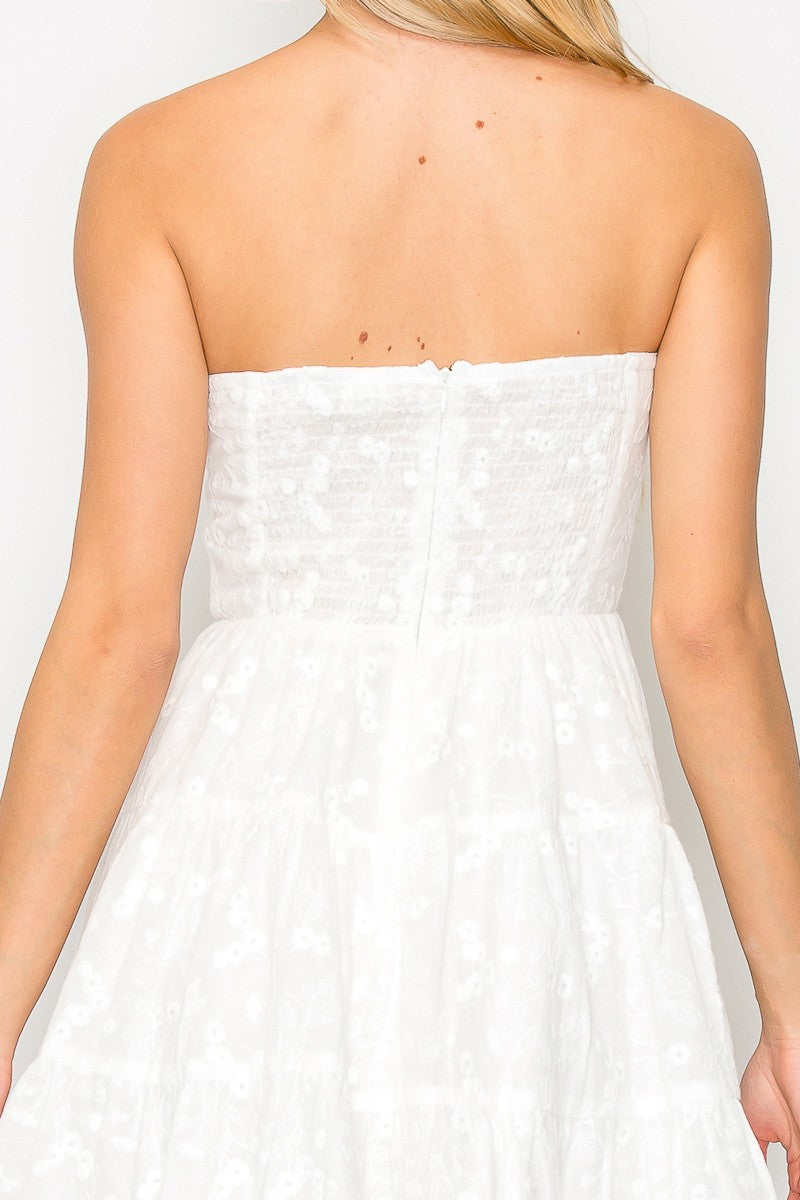 Strapless mini dress with key hole cutout at the bust.