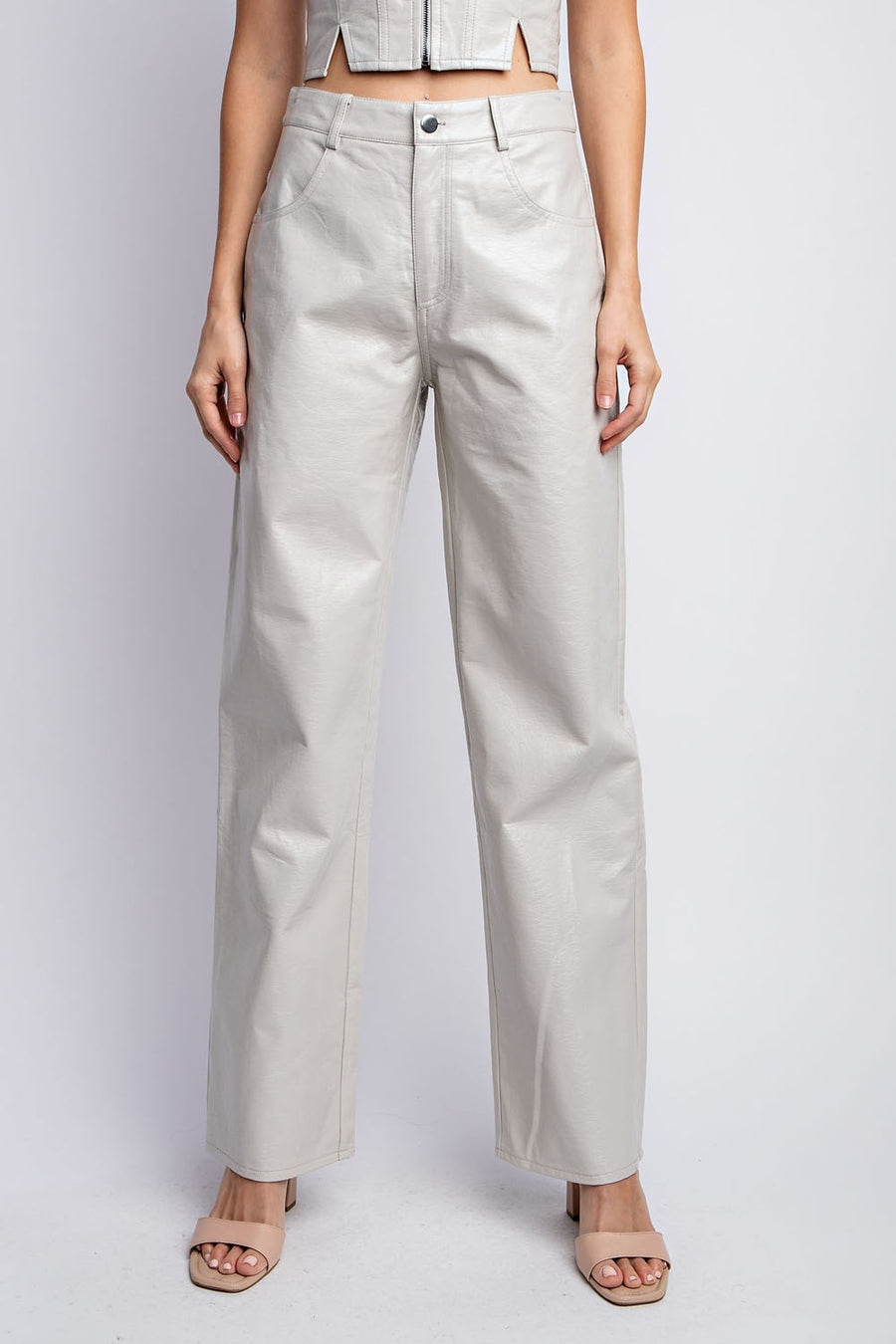 Leather straight leg pants in the color bone. 