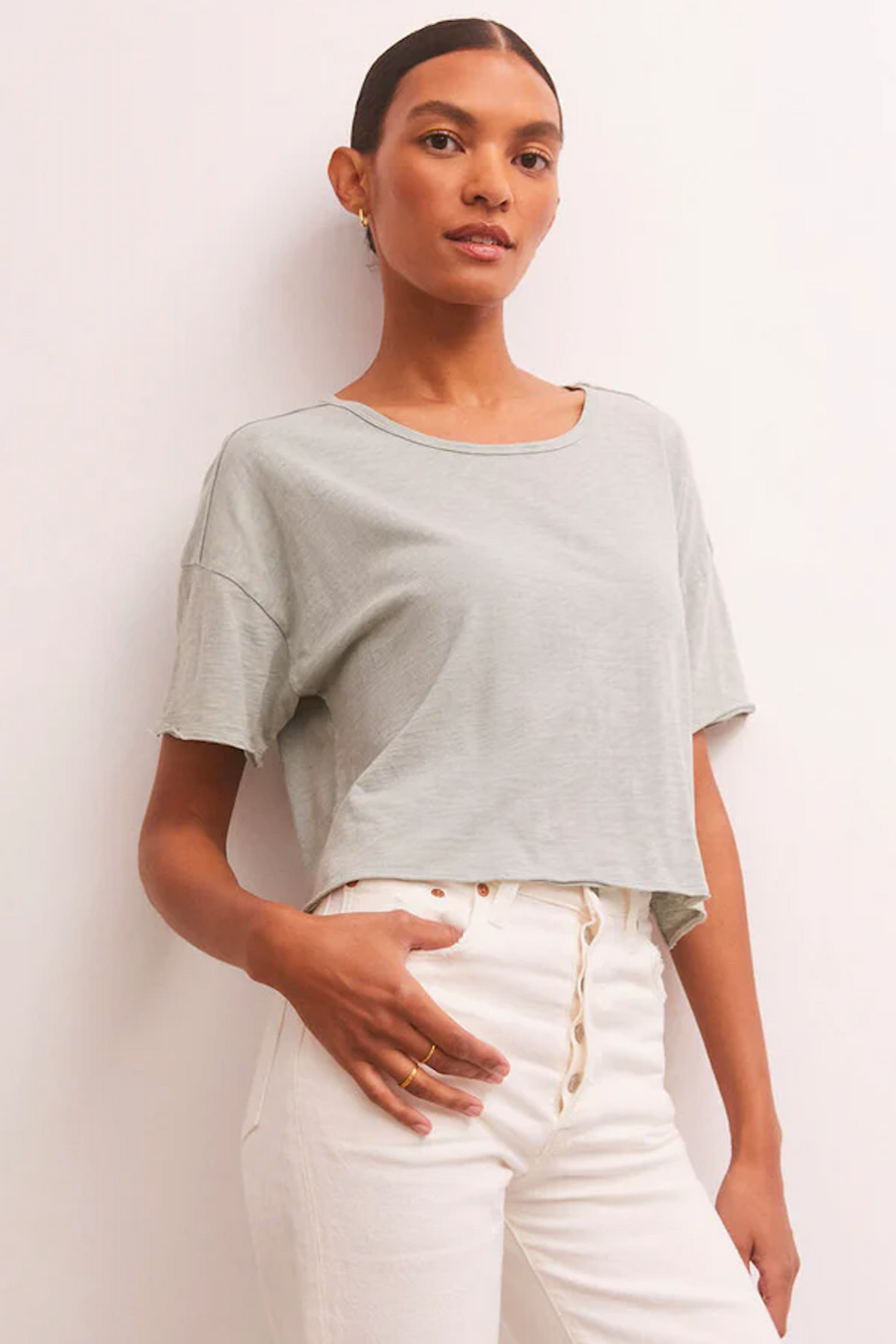 Short sleeve cropped shirt in the color worn jade. 