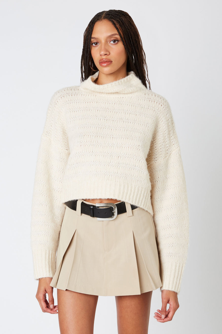 Ribbed turtle neck sweater in the color oatmeal. 