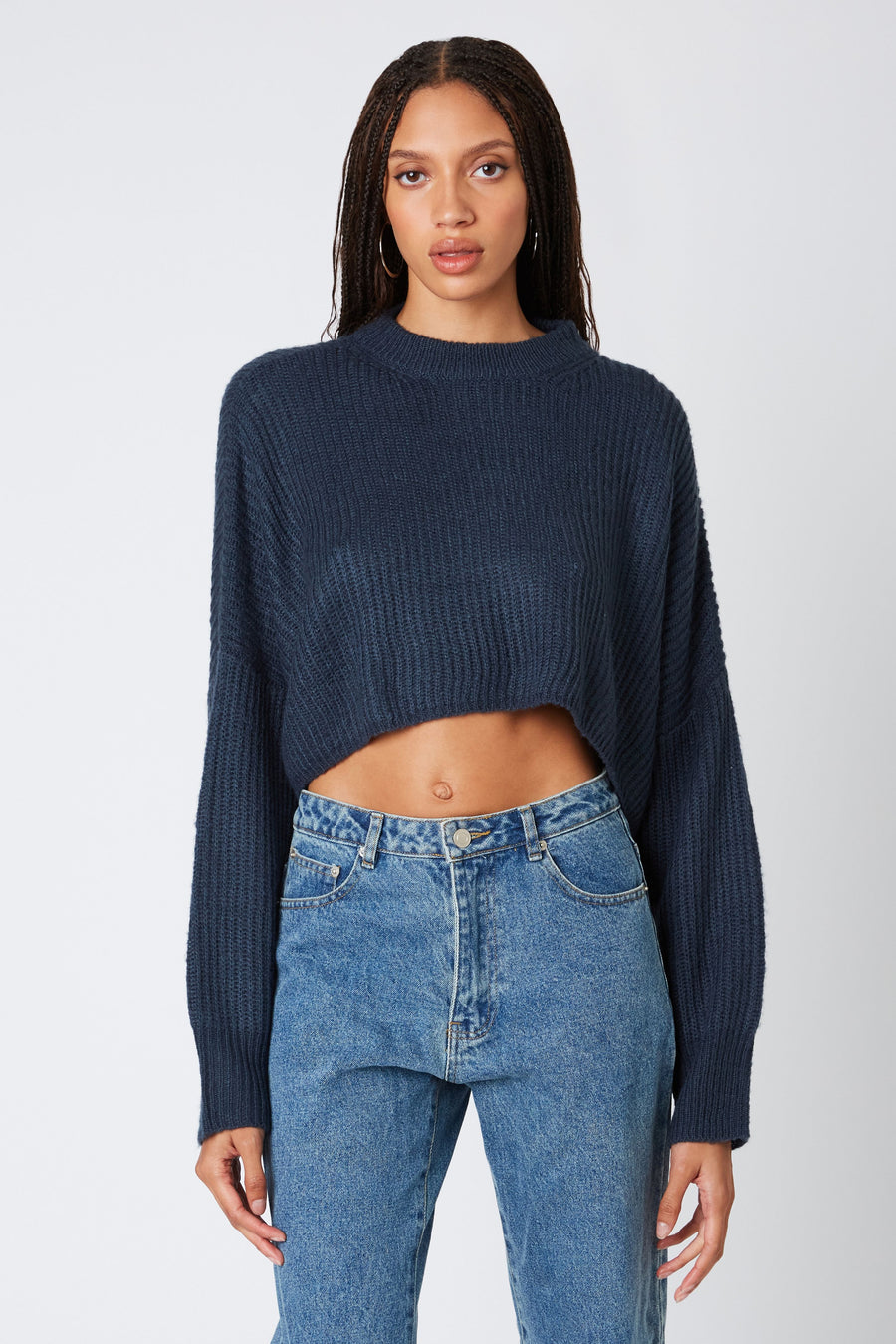 Cropped round neck sweater in the color dusk. 
