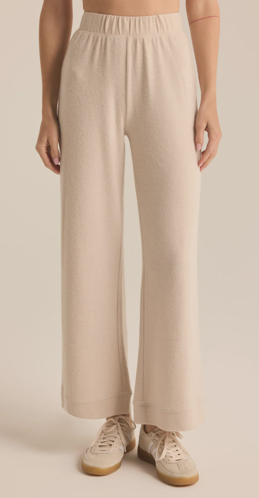 Featuring a cozy stringless wide leg sweatpants in the color light oatmeal heather