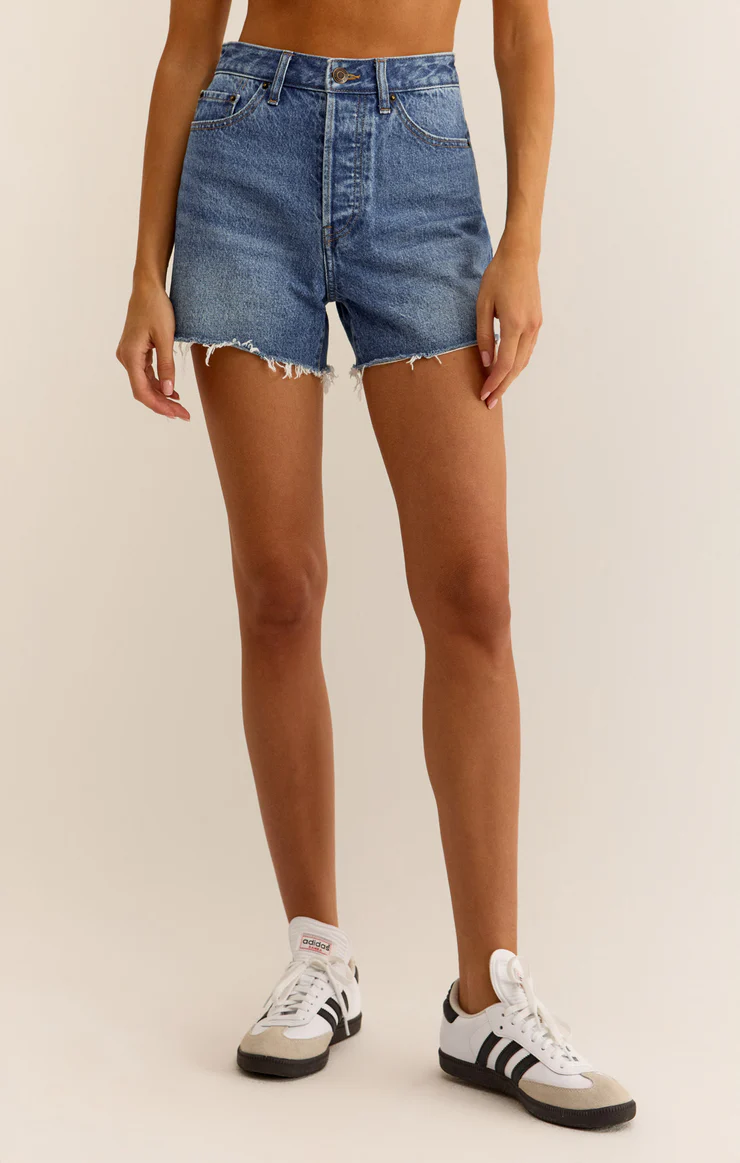 High-rise shorts with raw hemline, no rips.
