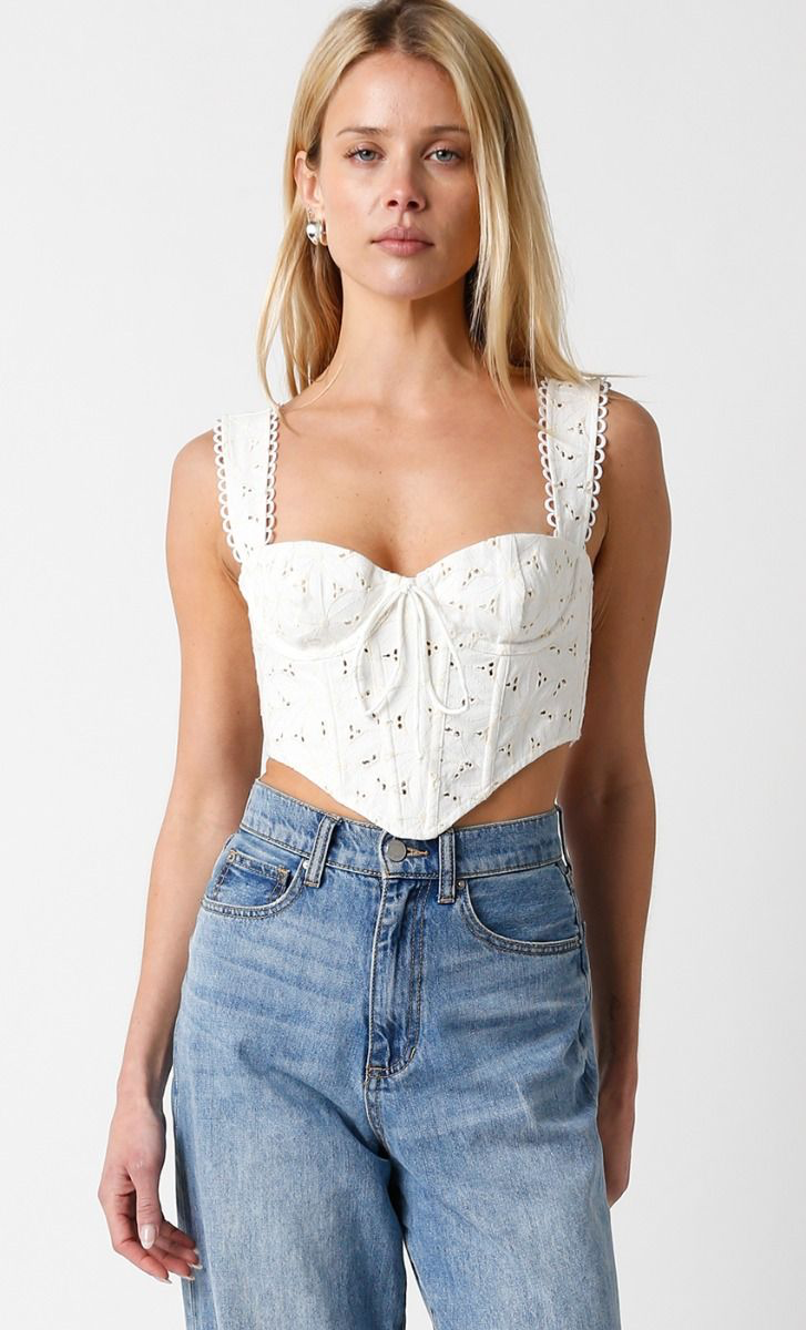 Cropped corset top with eyelet details and thick straps.