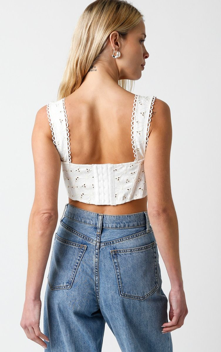 Cropped corset top with eyelet details and thick straps.