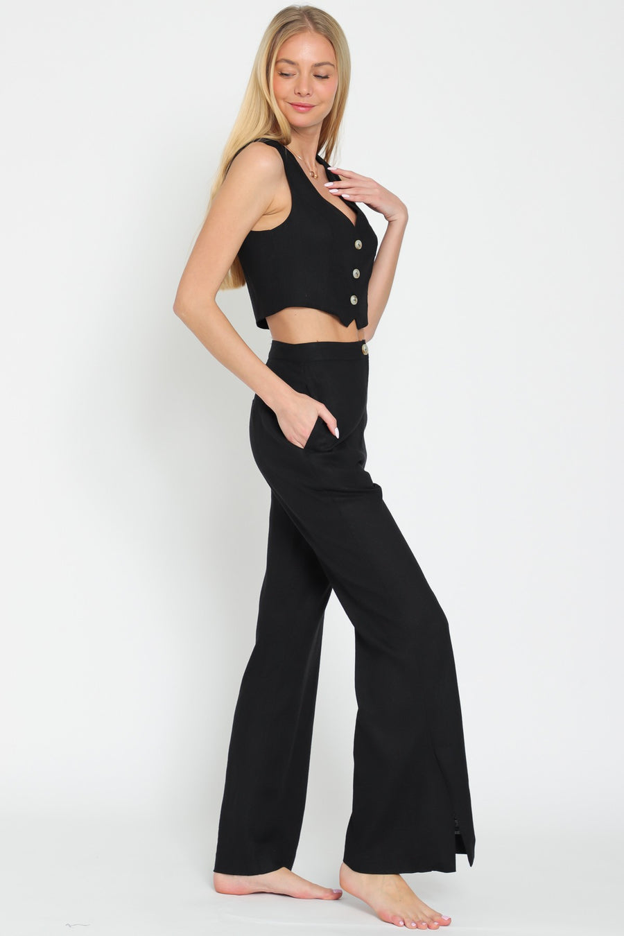 High waisted pants with pockets and button detail.