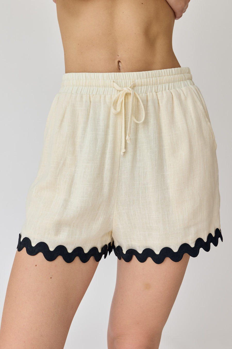 Drawstring shorts with wave trim detail.