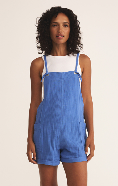 Featuring a light weight, relaxed fit romper with patch pockets and adjustable straps. Comes on bay blue and black 