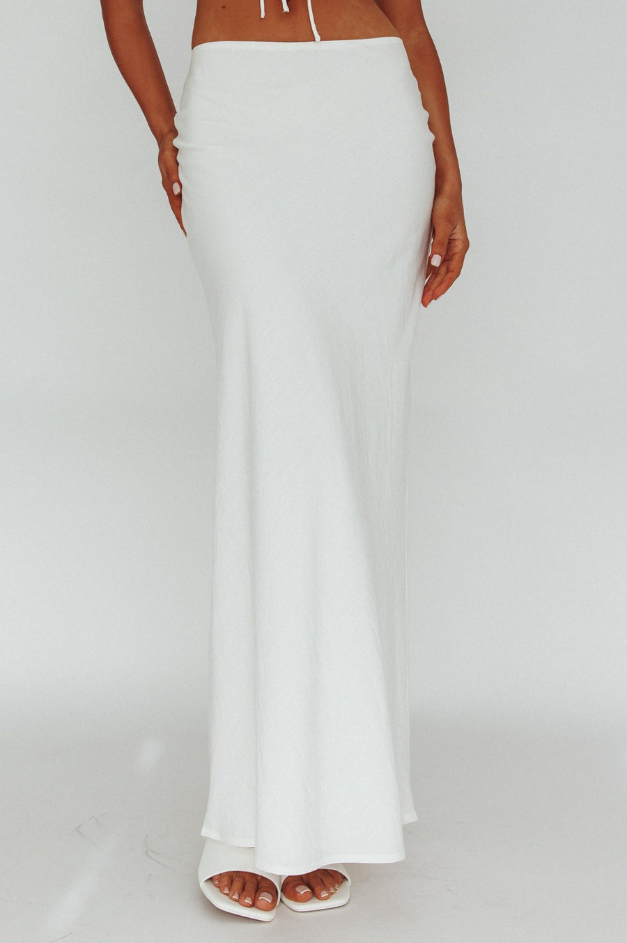 Pairs with the matching Gizmo Top

Featuring a zip up maxi skirt in the color white 