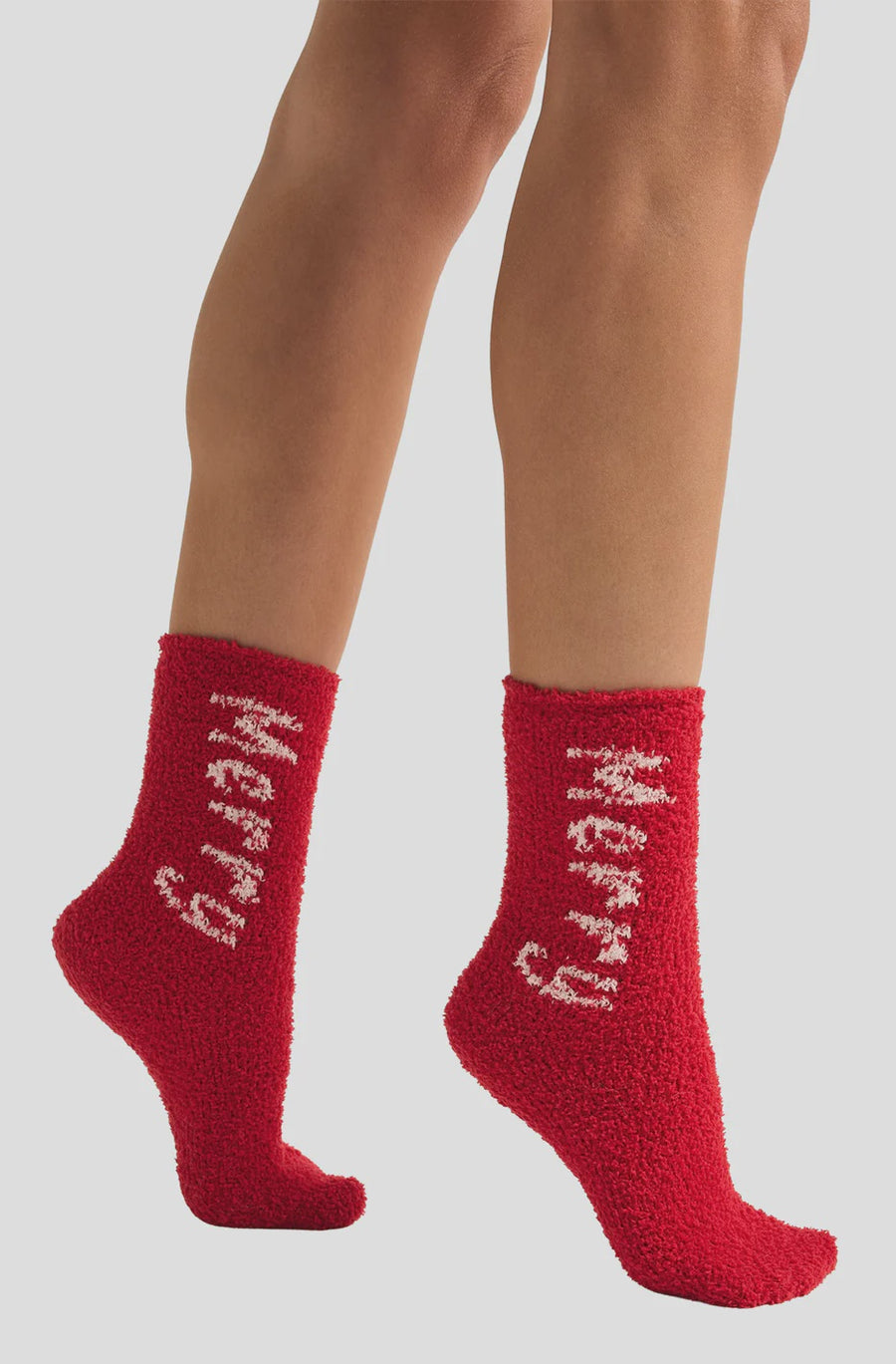 Featuring a cozy two pack plush socks in the color haute red