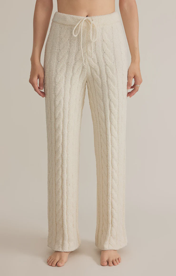 Featuring a drawstring cozy plush straight leg cable knit pants in the color sea salt