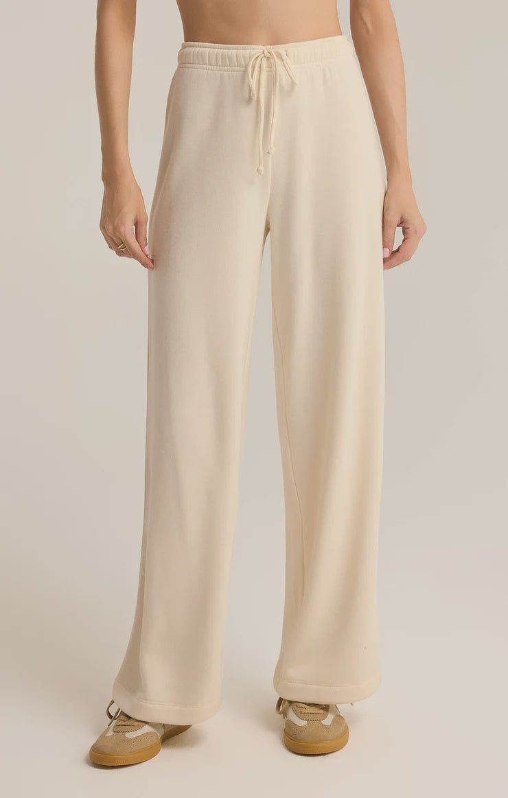 Featuring a cozy high rise fleece fabric straight leg sweatpants with drawstring in the color sea salt