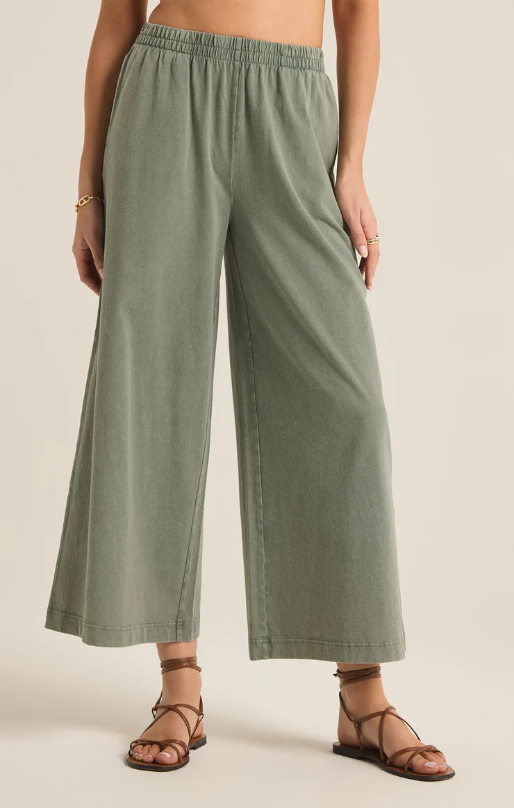 Featuring an elastic high waisted crop pant in the color plam green 